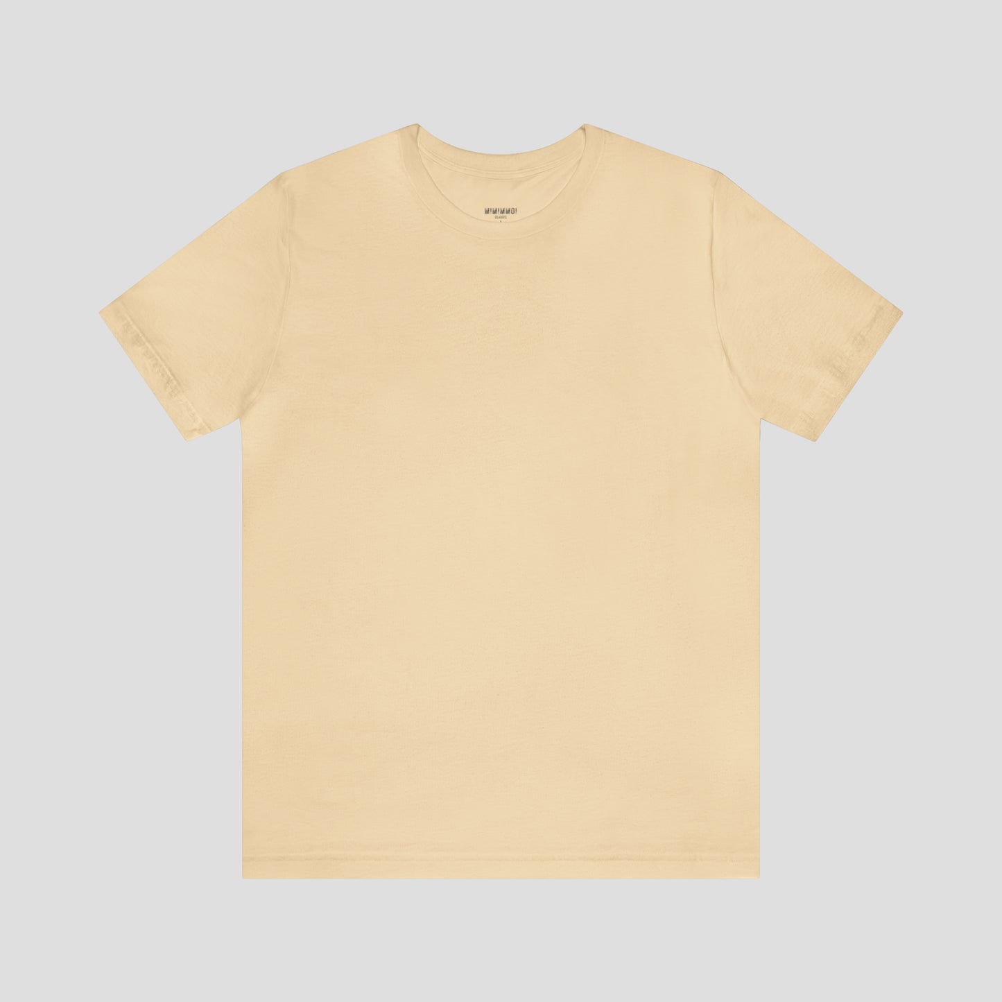 Solid natural tan colored t-shirt with no image or text, against a gray background.