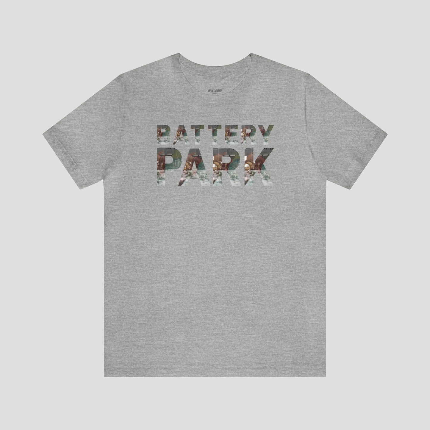 Light gray t-shirt with Battery Park in block letters. A picture of the SeaGlass Carousel is in each block letter against light gray background.