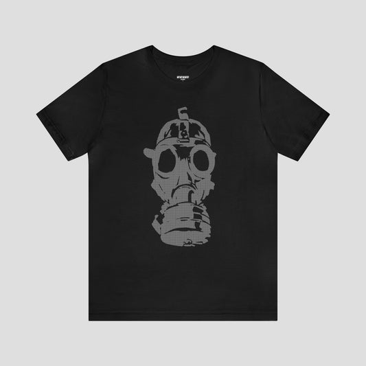 Black t-shirt with a large gray image of a gas mask in center, against a gray background.