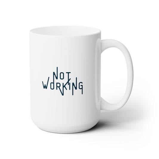 The words "Not Working" in a navy font with thin extended letters on white mug with right handle against a white background.