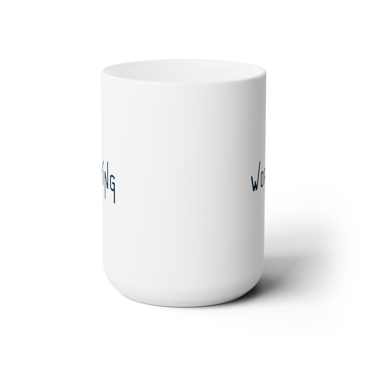 Side view of the words "Not Working" in a navy font with thin extended letters on both sides of white mug against a white background.