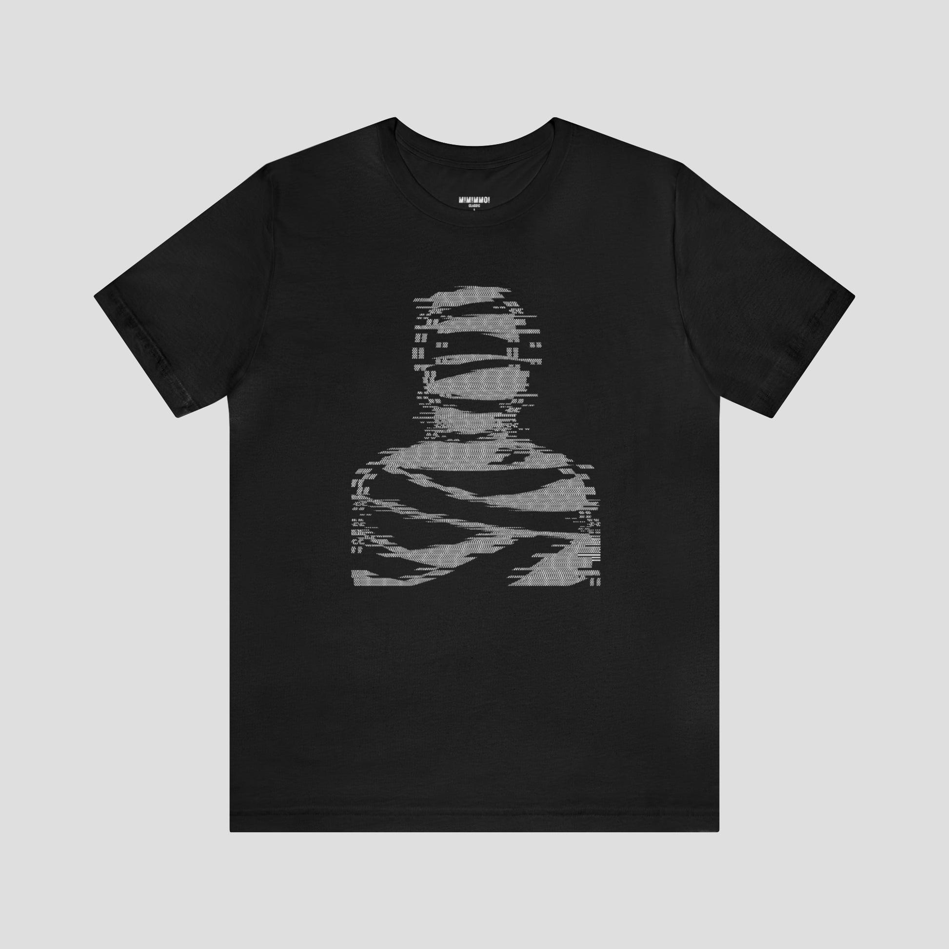 Black t-shirt with large white digitized image of a mummy in center, against a gray background.