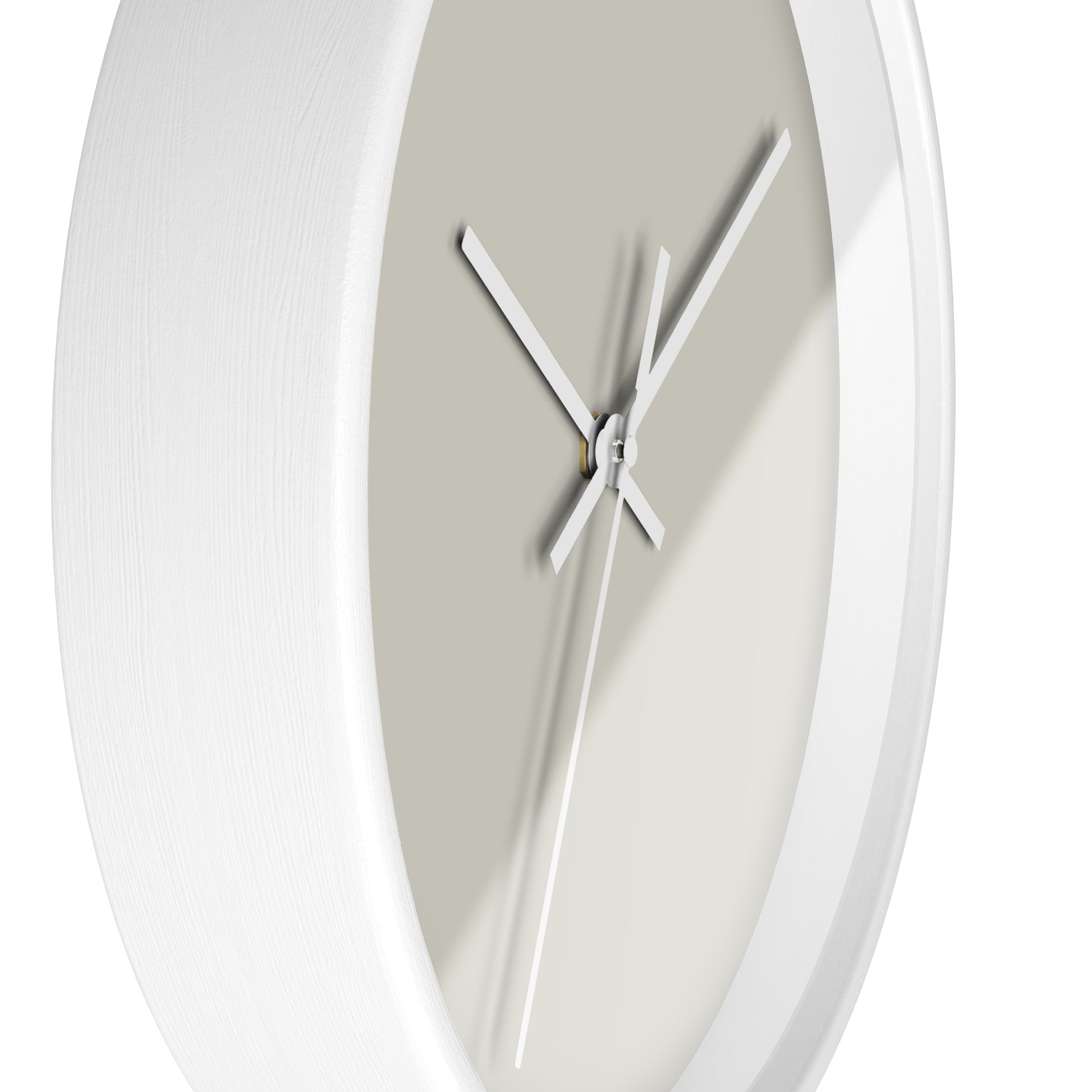 Side view of white circular wooden framed clock with tan background and white hands against white background.