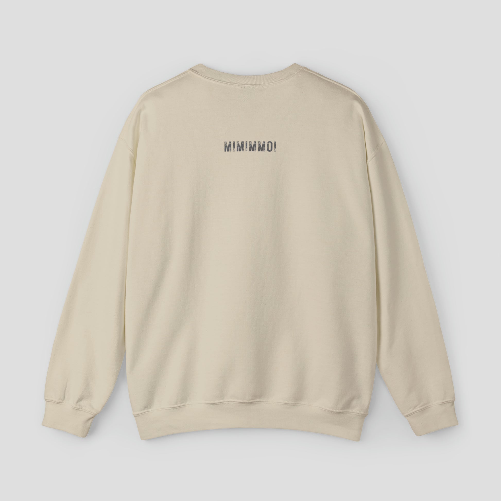 Back view of tan sweatshirt with MIMIMMOI in gray grunge font against light gray background.