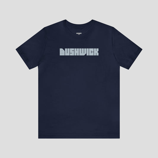 Navy t-shirt with "Bushwick"with "Bushwick" in white block letters (in center) against a white background.