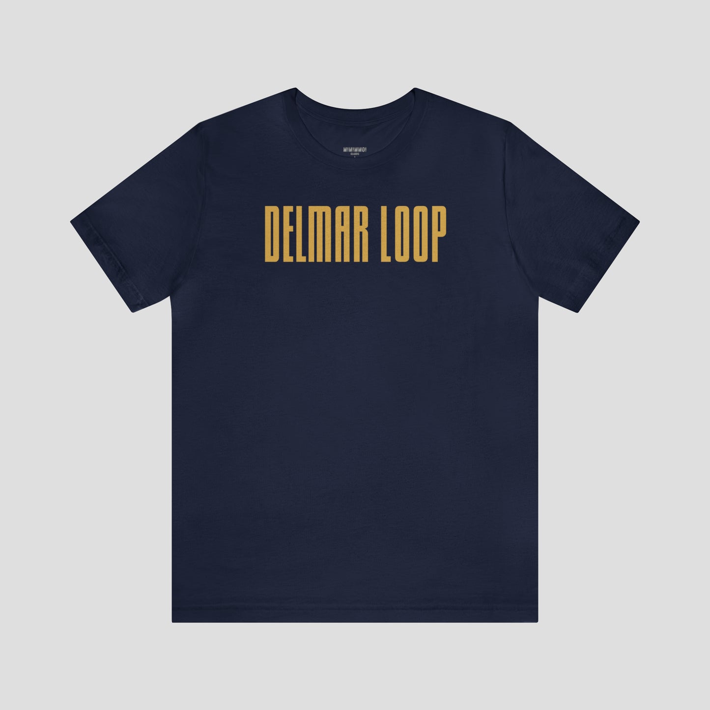 Navy t-shirt with the words "Delmar Loop" in large, narrow, yellow lettering, against a gray background.