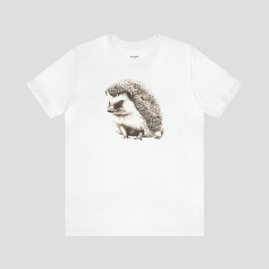 White t-shirt with large illustrated image of white and brown hedgehog in the center, against a gray background.