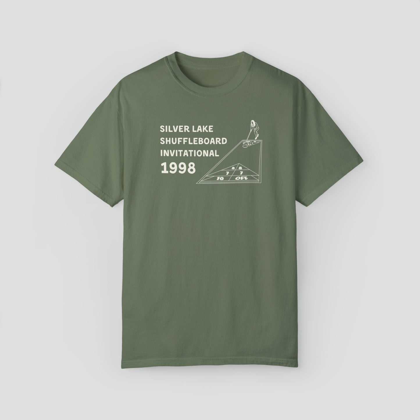 Green t-shirt with the words "Silver Lake Shuffleboard Invitational 1998" in white letters next to image of person playing shuffleboard across the chest, against a gray background.