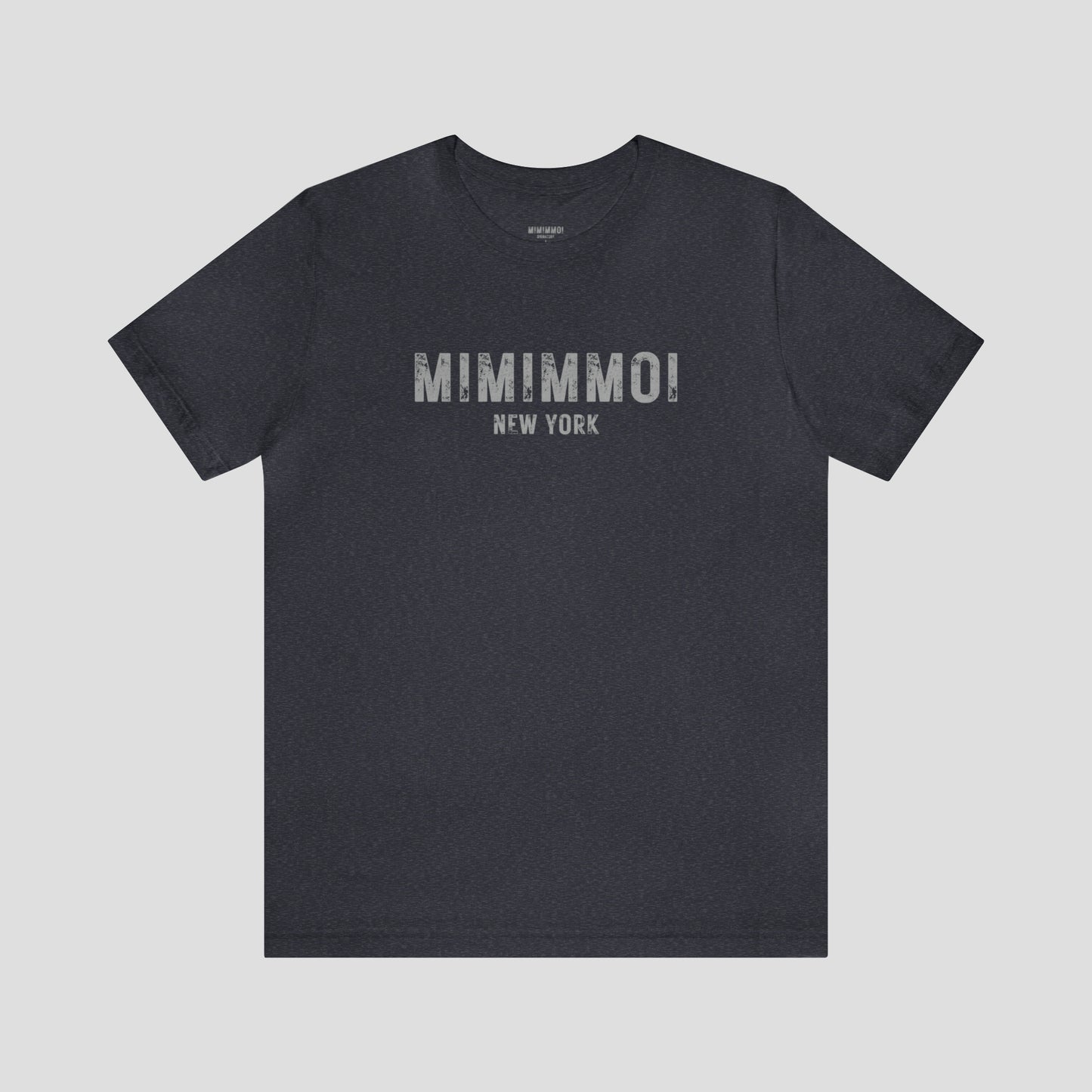 Navy blue t-shirt with the words Mimimmoi New York in distressed gray block letters across the chest, against a gray background.