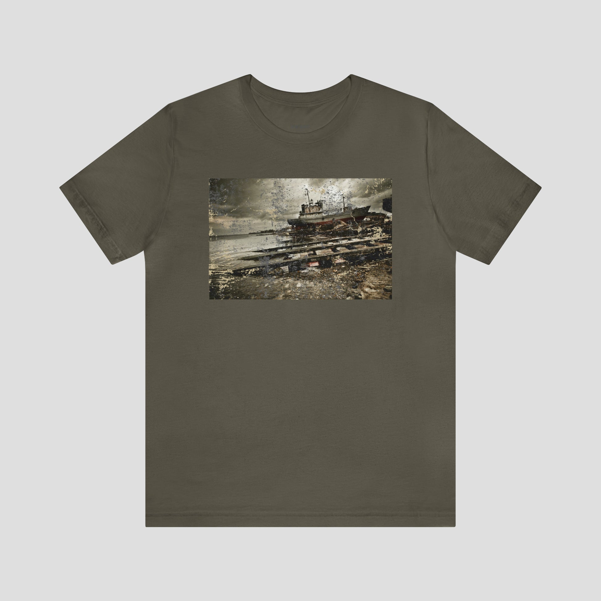 Army green t-shirt with distressed image of a shipwreck across the chest, against a gray background.