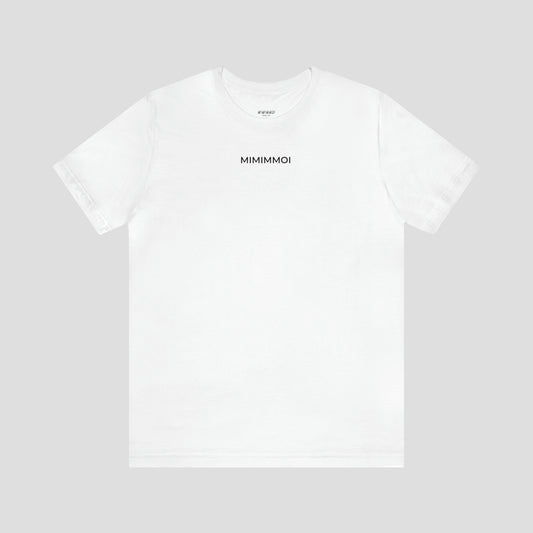 White t-shirt with the word "Mimimmoi" in small black letters a few inches under the neckline, against a gray background.