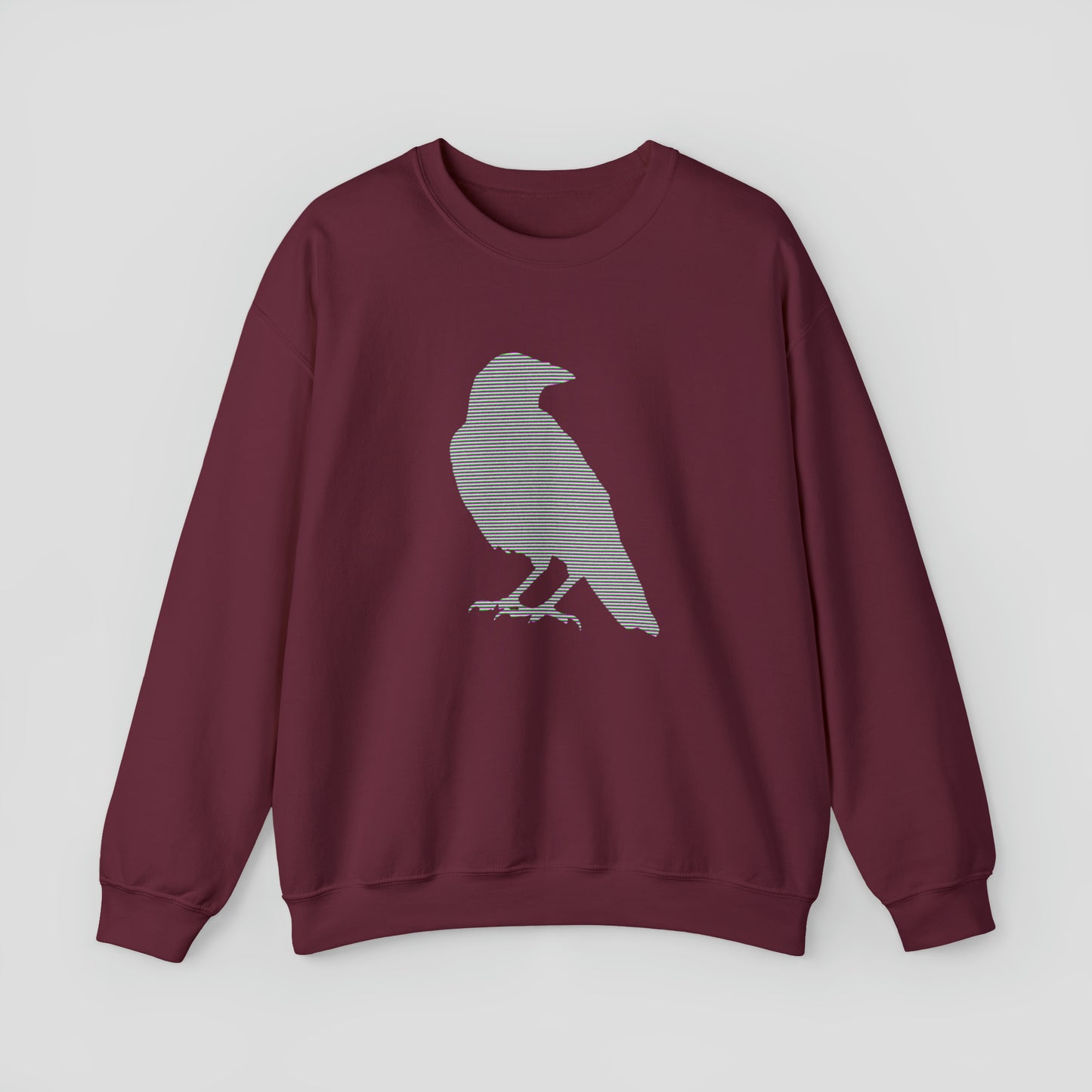 Maroon sweatshirt with large multi-lined silhouette of a raven across the chest, against a gray background.