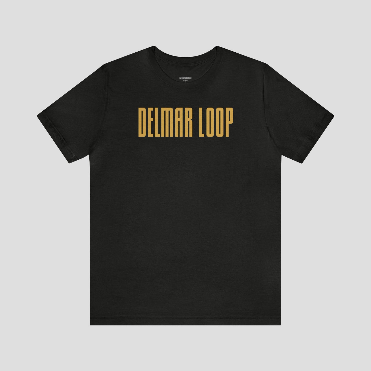 Vintage black t-shirt with the words "Delmar Loop" in large, narrow, yellow lettering, against a gray background.